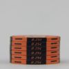 Stack of orange ceramic poker chips $0.25 HotGen
